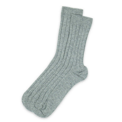 Pair of light gray socks on a white background