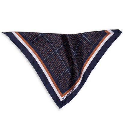 Navy blue stylised check pocket square with blue, white and gold border photographed on a white background.