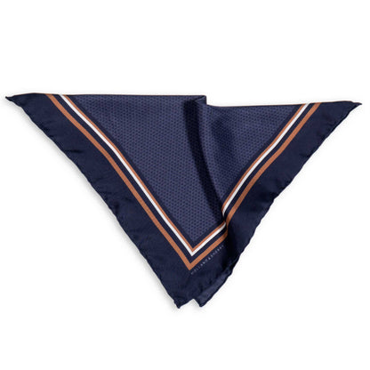 Navy blue pocket square with white and gold border photographed on a white background