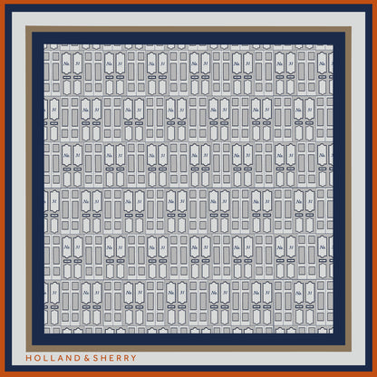 Patterned scarf with entrance door designs and  'Holland & Sherry' branding