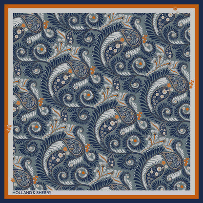 Stylised paisley-style patterned scarf with blue, orange, and light grey with 'Holland & Sherry' branding.