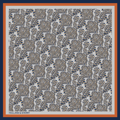 Paisley patterned scarf with Holland & Sherry branding.