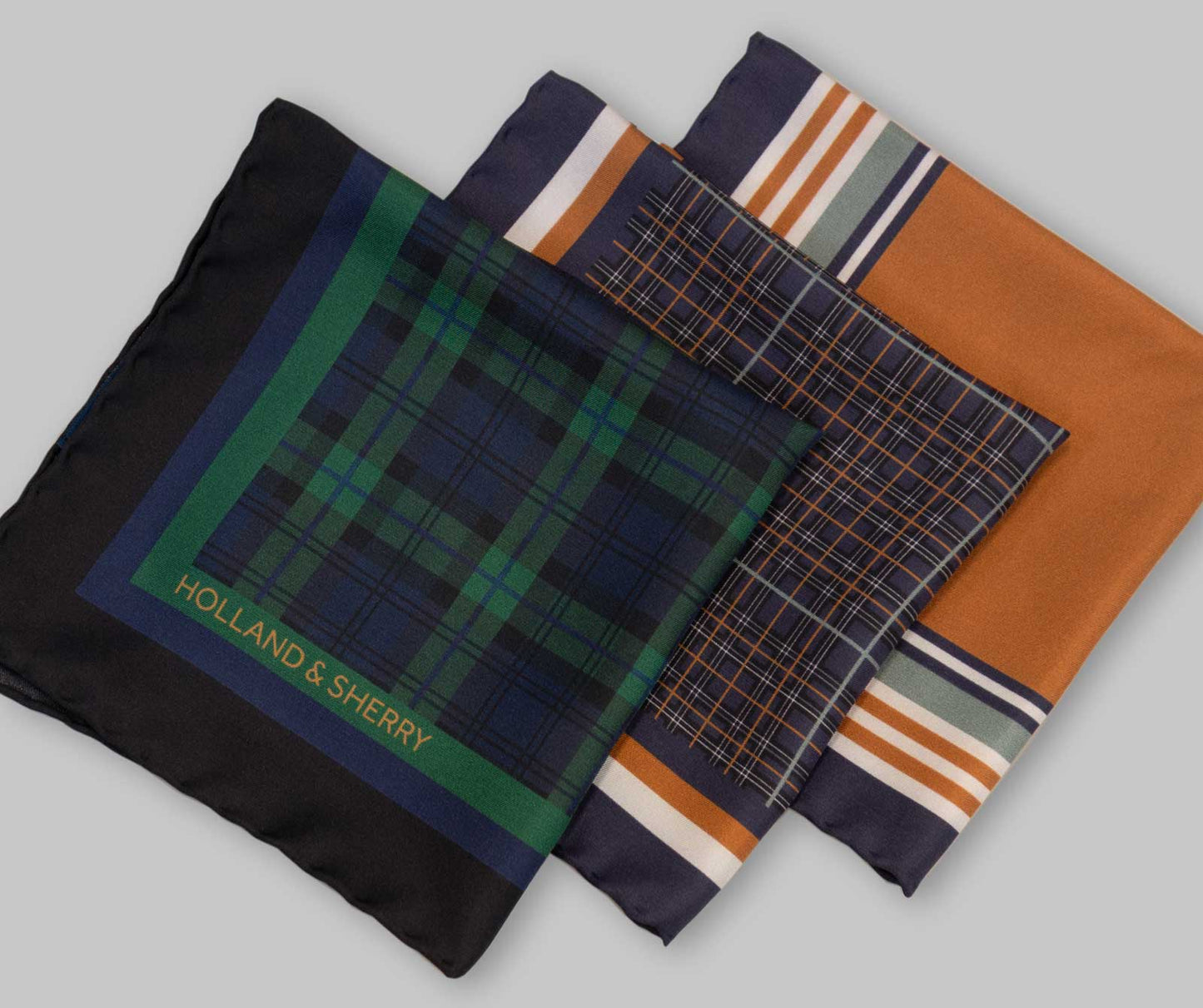 Collection of patterned pocket squares with 'Holland & Sherry' branding on a light gray background