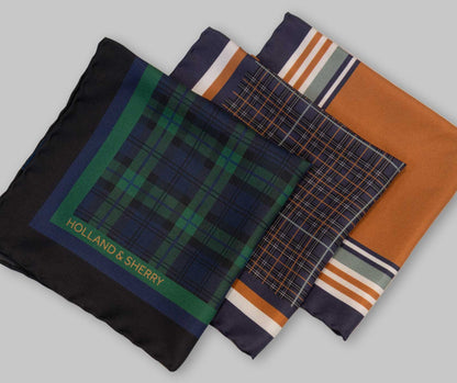 Collection of patterned pocket squares with 'Holland & Sherry' branding on a light gray background